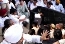 BREAKING: Rahul and Priyanka sit on the road outside the PM's residence; Congress MPs being detained.