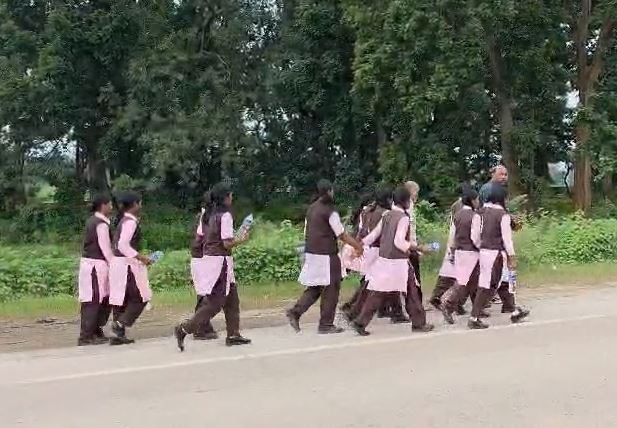Stir caused by 45 female students marching on foot; officials sent a bus, and they reached the Collectorate.