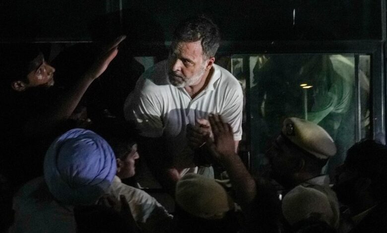 Rahul Gandhi climbed a barricade and sat on a protest with Priyanka; police detained them after nine hours.